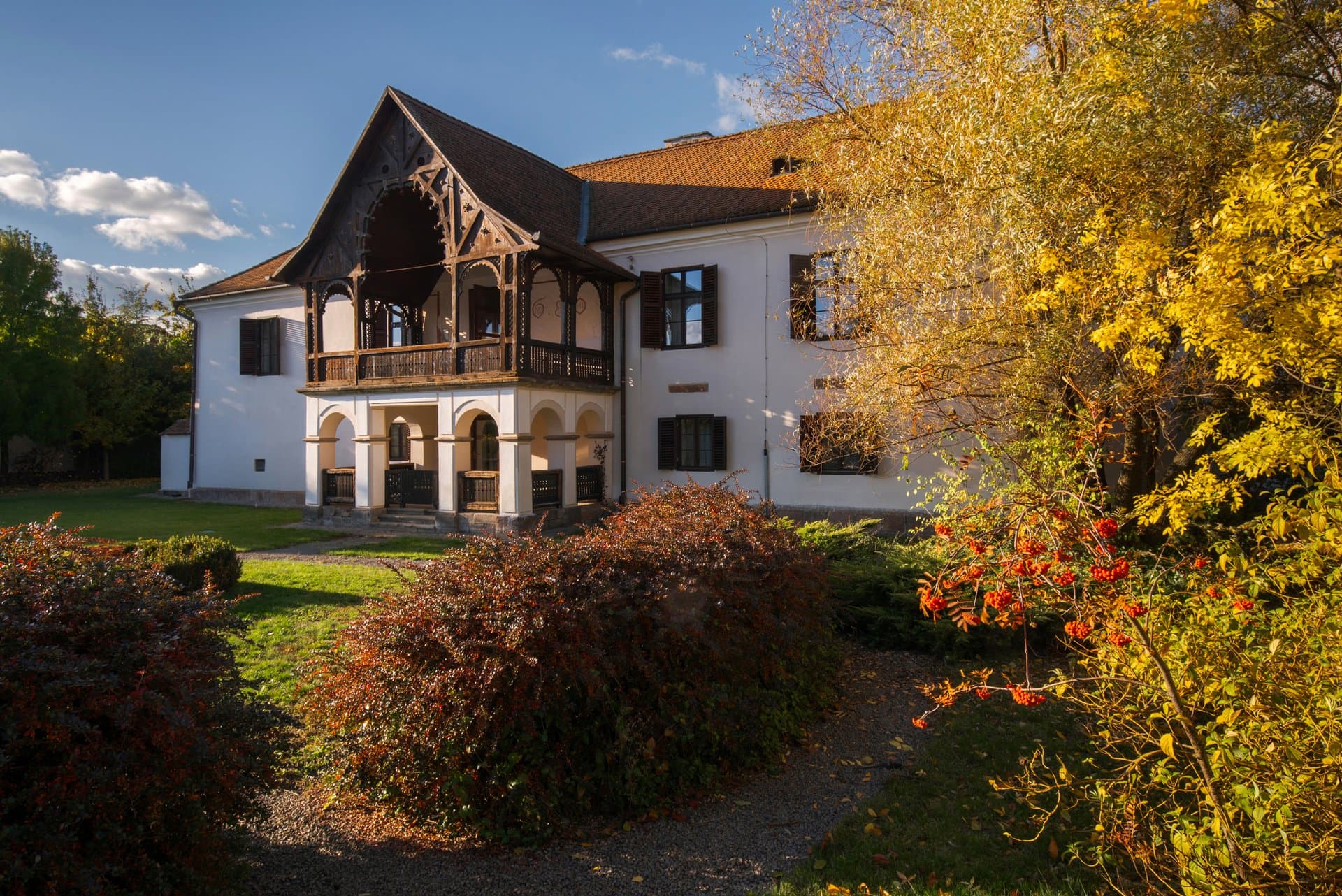 Castle courtyard in autumn with golden foliage