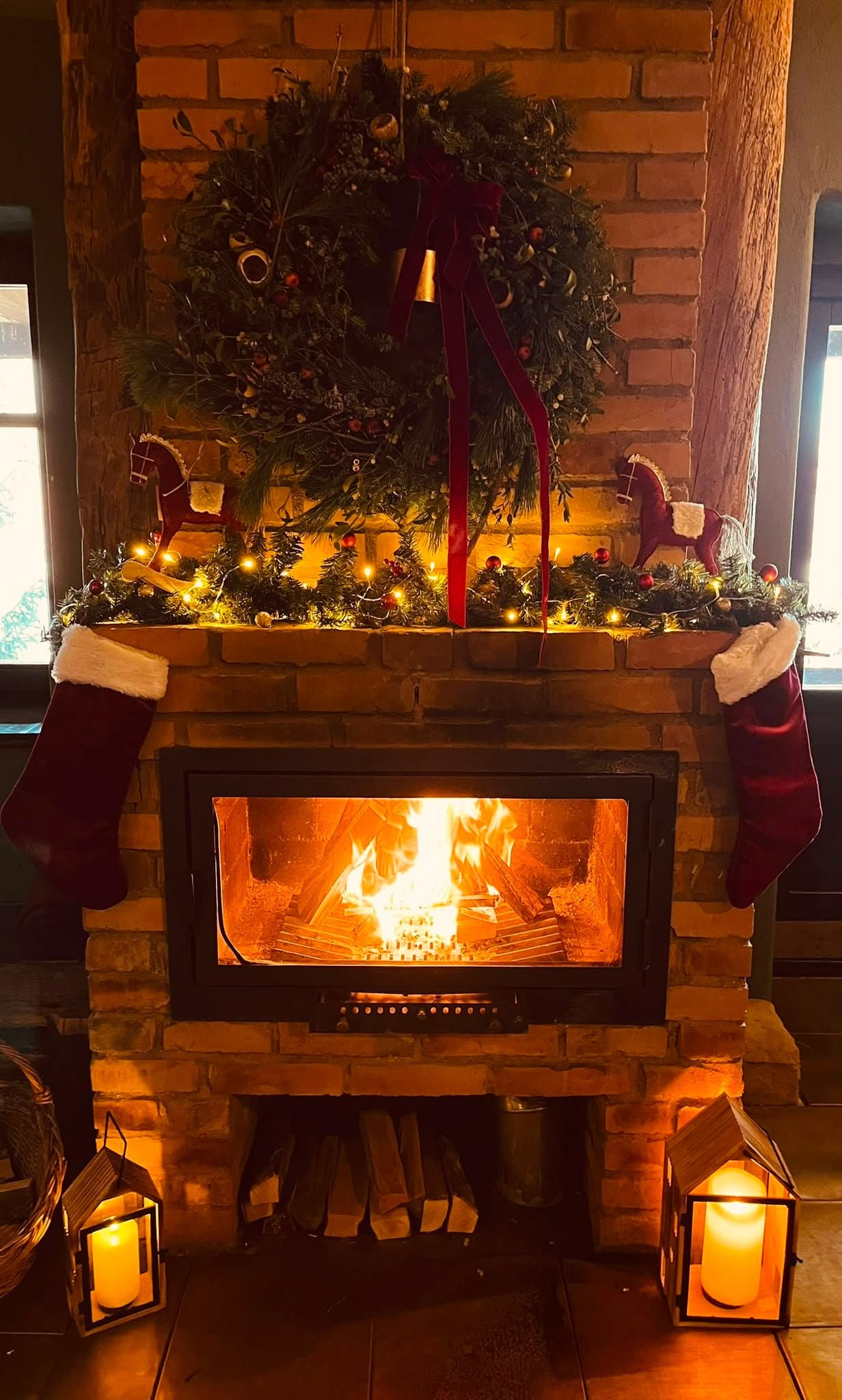 Decorated fireplace glowing at Daniel Castle during the New Year's Eve season