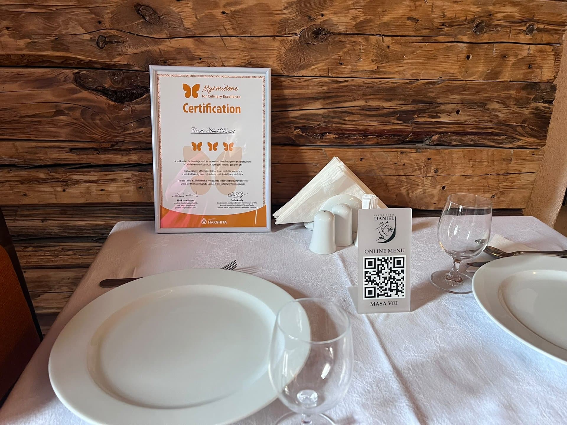 Myrmidone certification for culinary excellence displayed at Daniel Castle